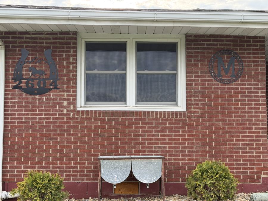Plasma cut horseshoe address sign installed